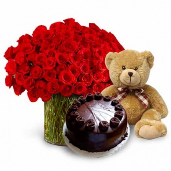 50 Red Roses in a Glass Vase with Teddy (10 inch) and Dark Chocolate Cake (Half Kg)
